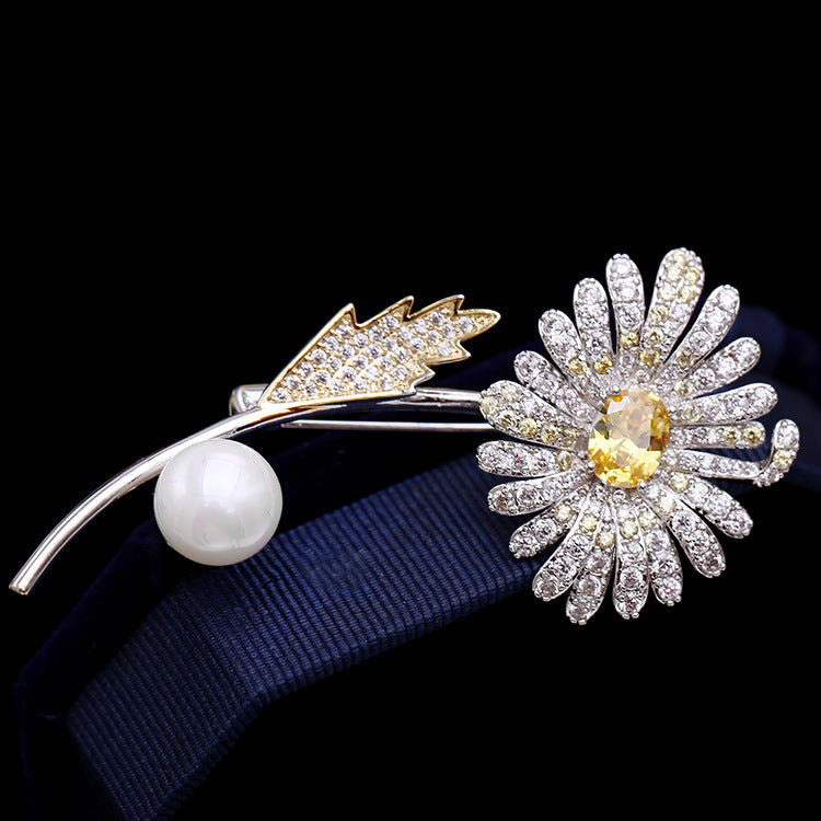 Electroplated gold pearl brooch