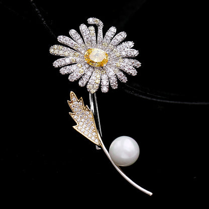 Electroplated gold pearl brooch